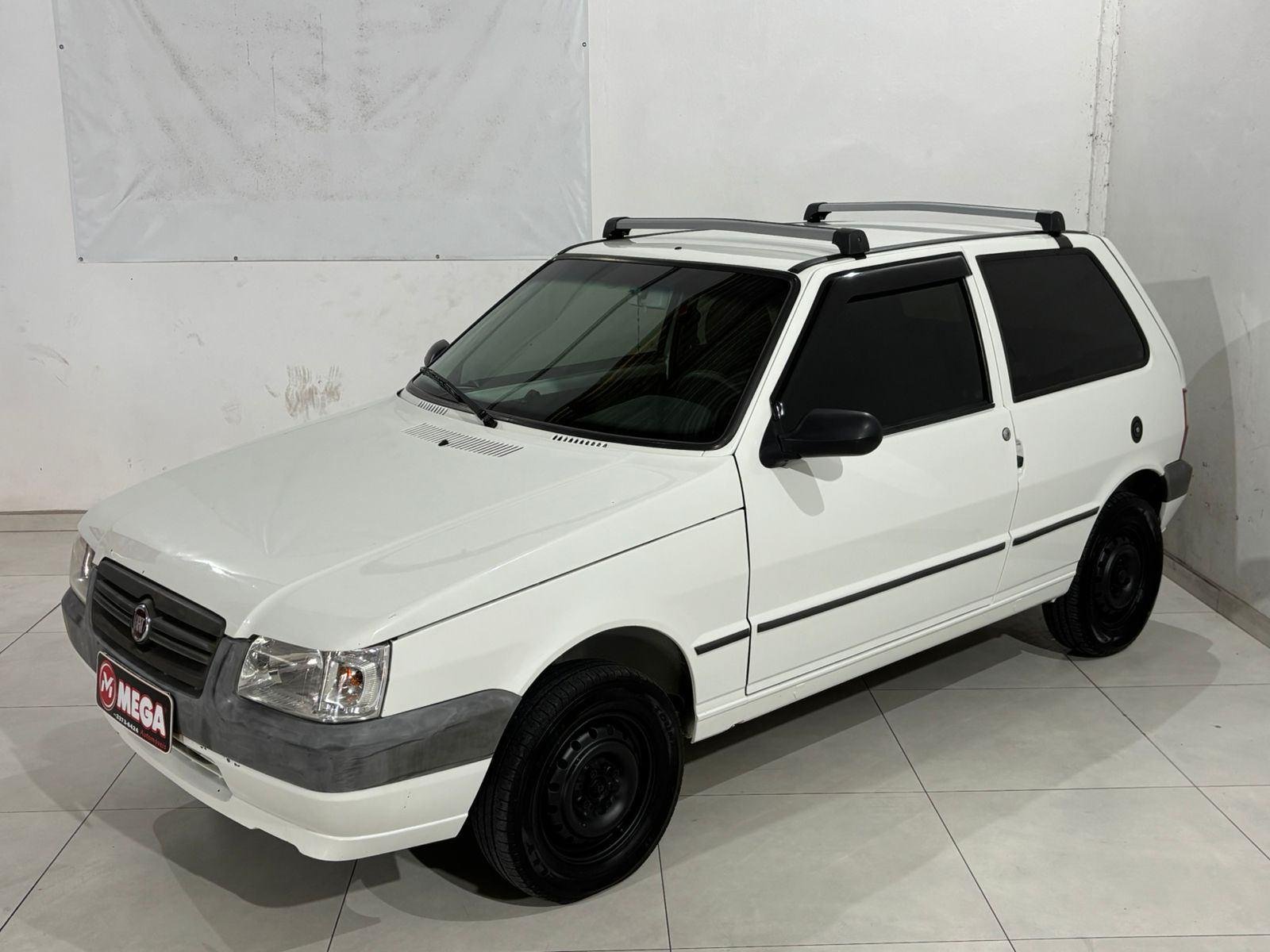 Fiat Uno Mille 1.0 Fire/ F.Flex/ ECONOMY 4p na cor Branco em Guaramirim / SC - 877863