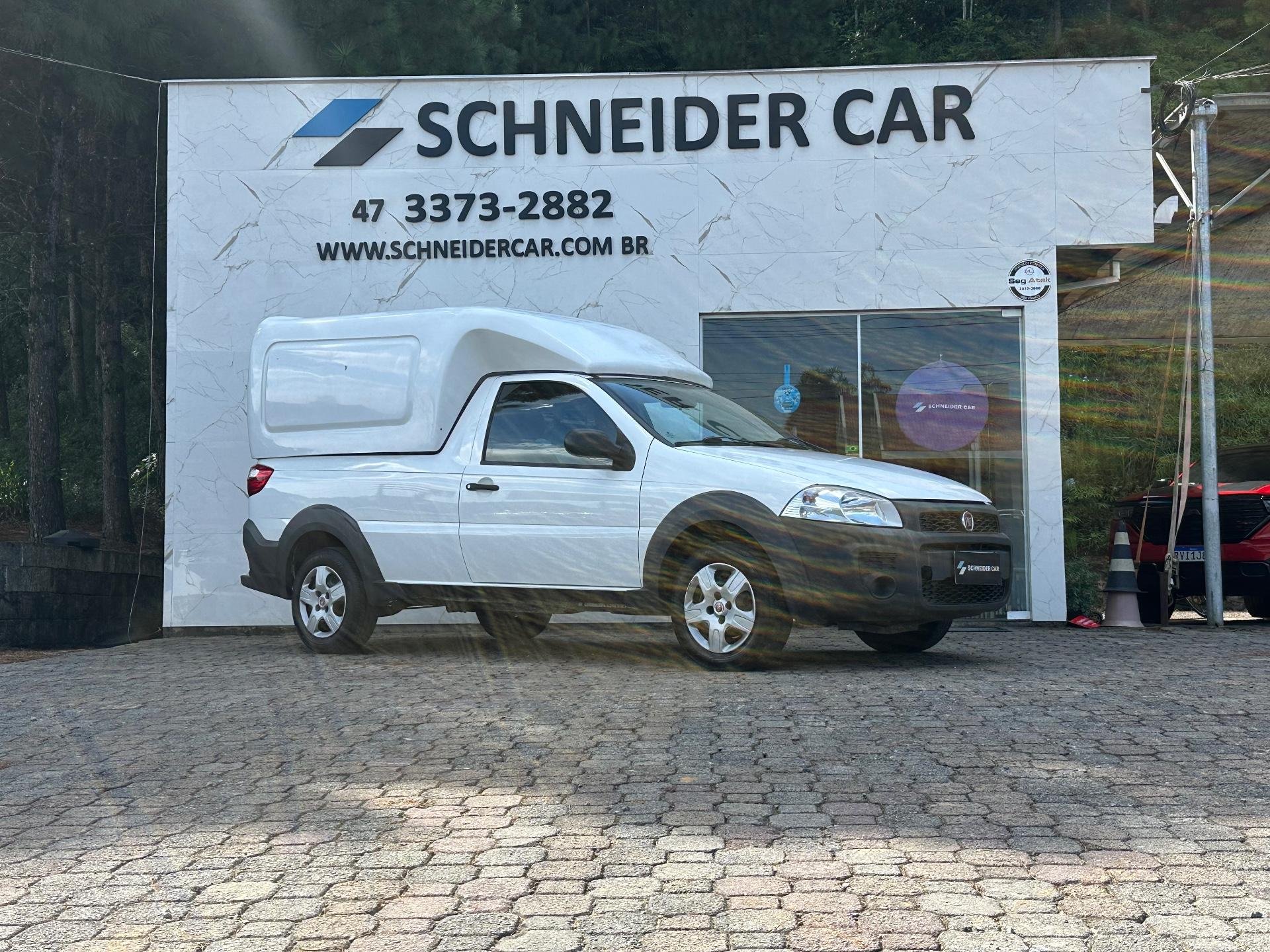 Fiat Strada Working HARD 1.4 Fire Flex 8V CS na cor Branco em Guaramirim / SC - 981331
